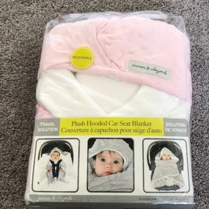 Soft, pink, plush hooded car seat blanket.